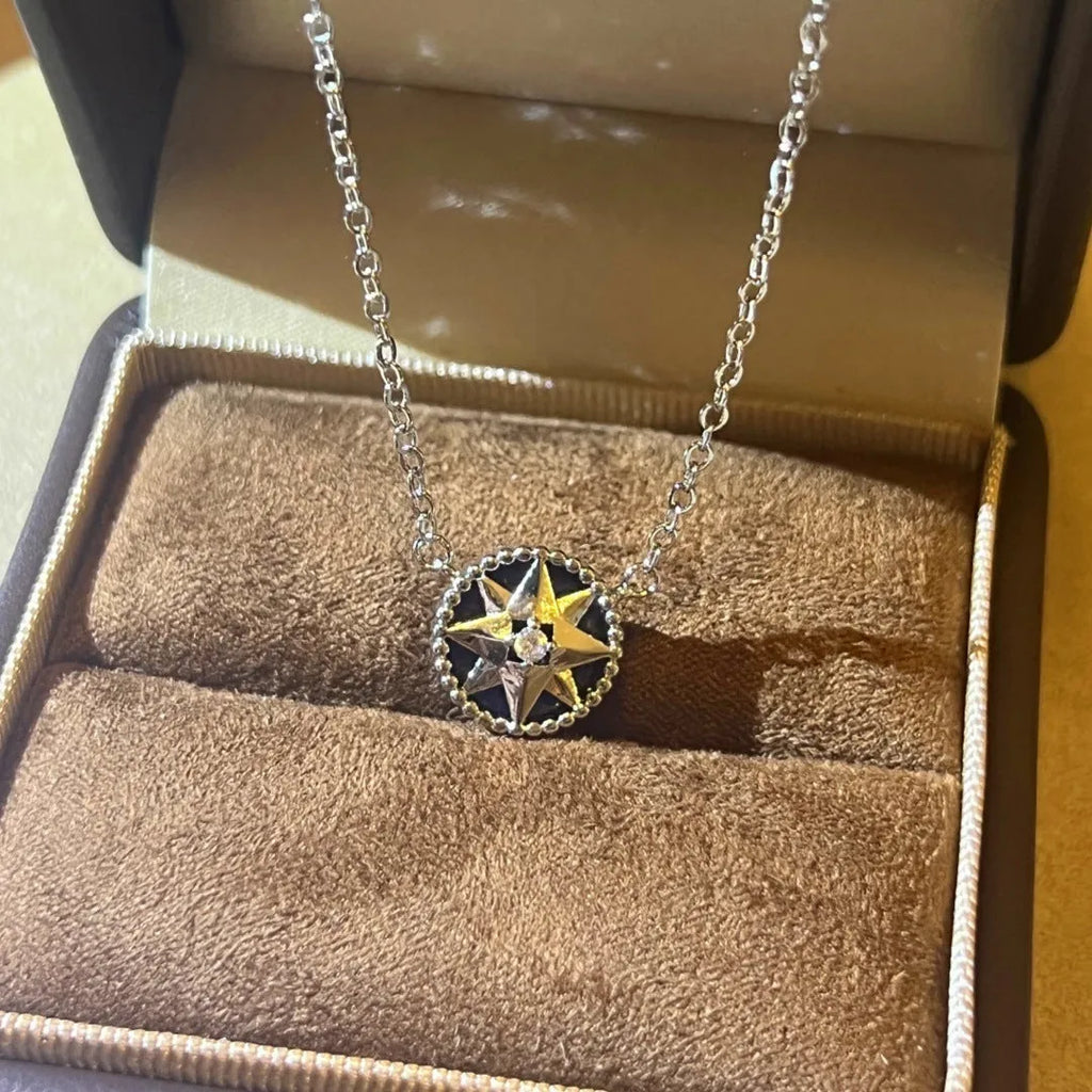 Gold-plated compass necklace for women with round black agate pendant on adjustable curb chain
