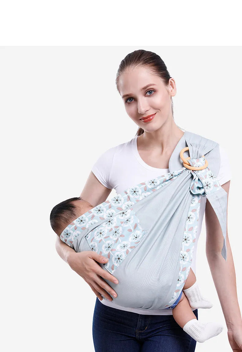 Baby wrap carrier sling in blue-green cotton mesh fabric, adjustable for newborn to 36 months, 50kg capacity