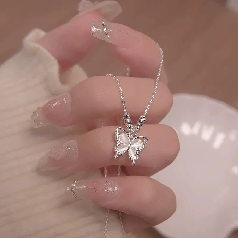 Women's silver butterfly necklace with square opal pendant on cross chain, adjustable length jewellery