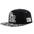 Cotton baseball cap with embroidered letters, adjustable strap, in black and white colours