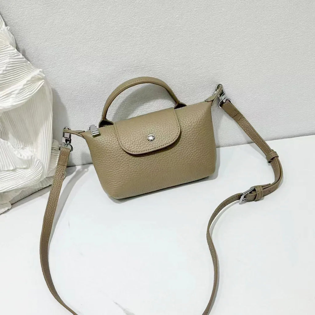 Top grain leather crossbody phone bag in dumpling shape with splicing detail available in black