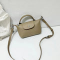 Top grain leather crossbody phone bag in dumpling shape with splicing detail available in black