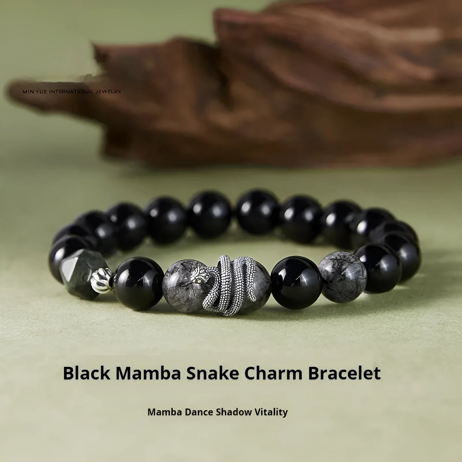 Black S925 sterling silver bracelet with snake modelling and obsidian stone details