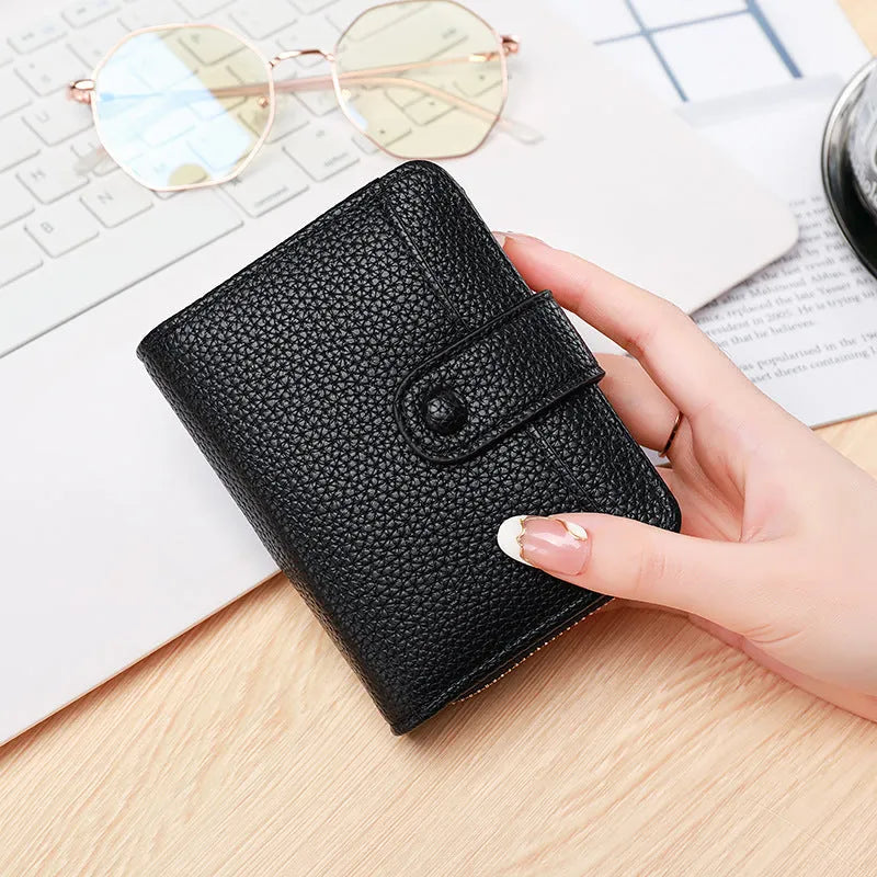 Ladies' short PU leather wallet with a lychee pattern, shown folded, in beige, pink, black, and red colour options.