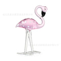 Pink crystal flamingo decorative sculpture on a table, modern simple style.