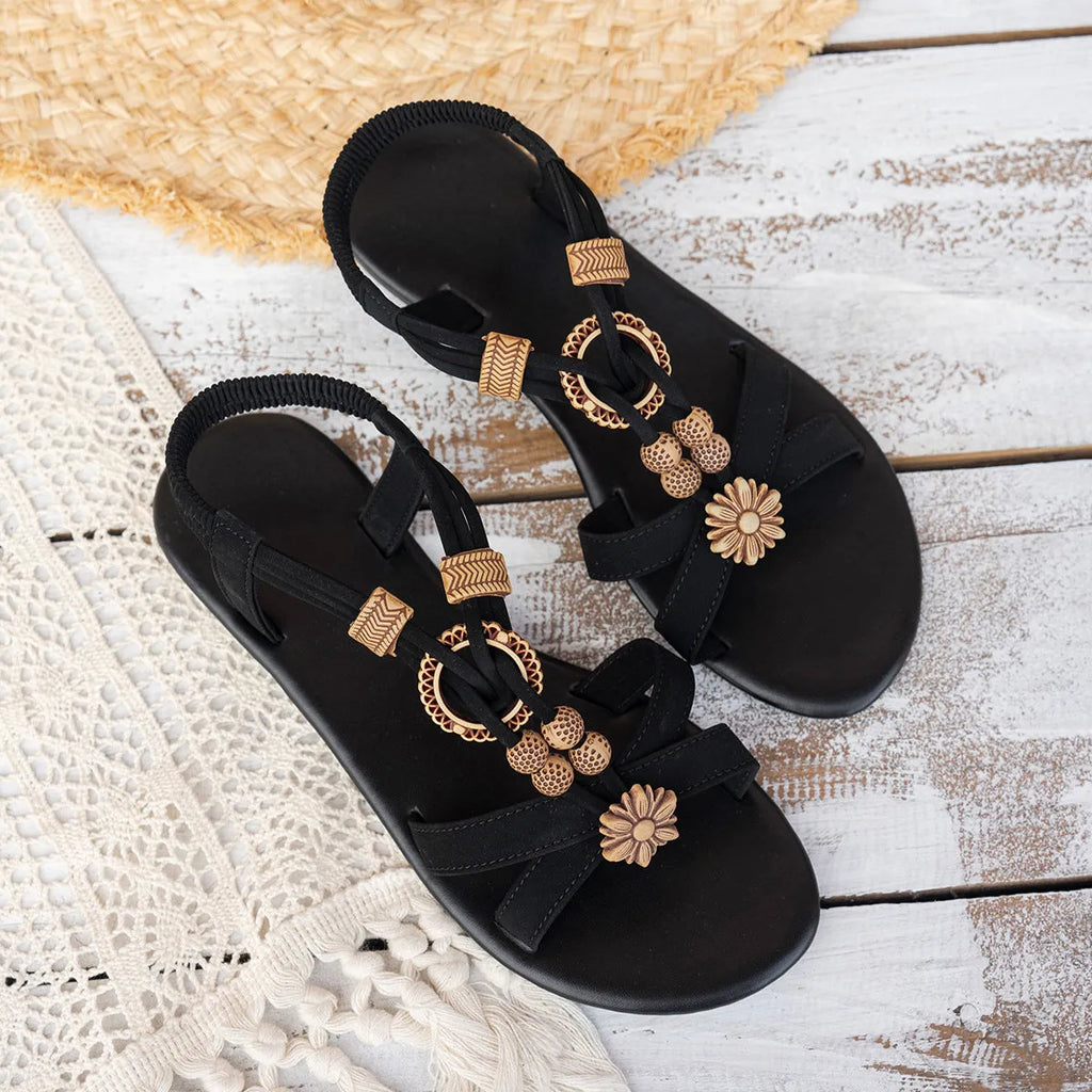 Black women's ethnic style flat sandals with beaded weave pattern and open toe design