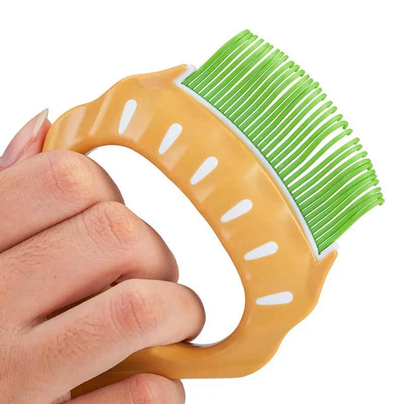 Green shell-shaped pet grooming brush with bent wire bristles and a plastic anti-slip handle.