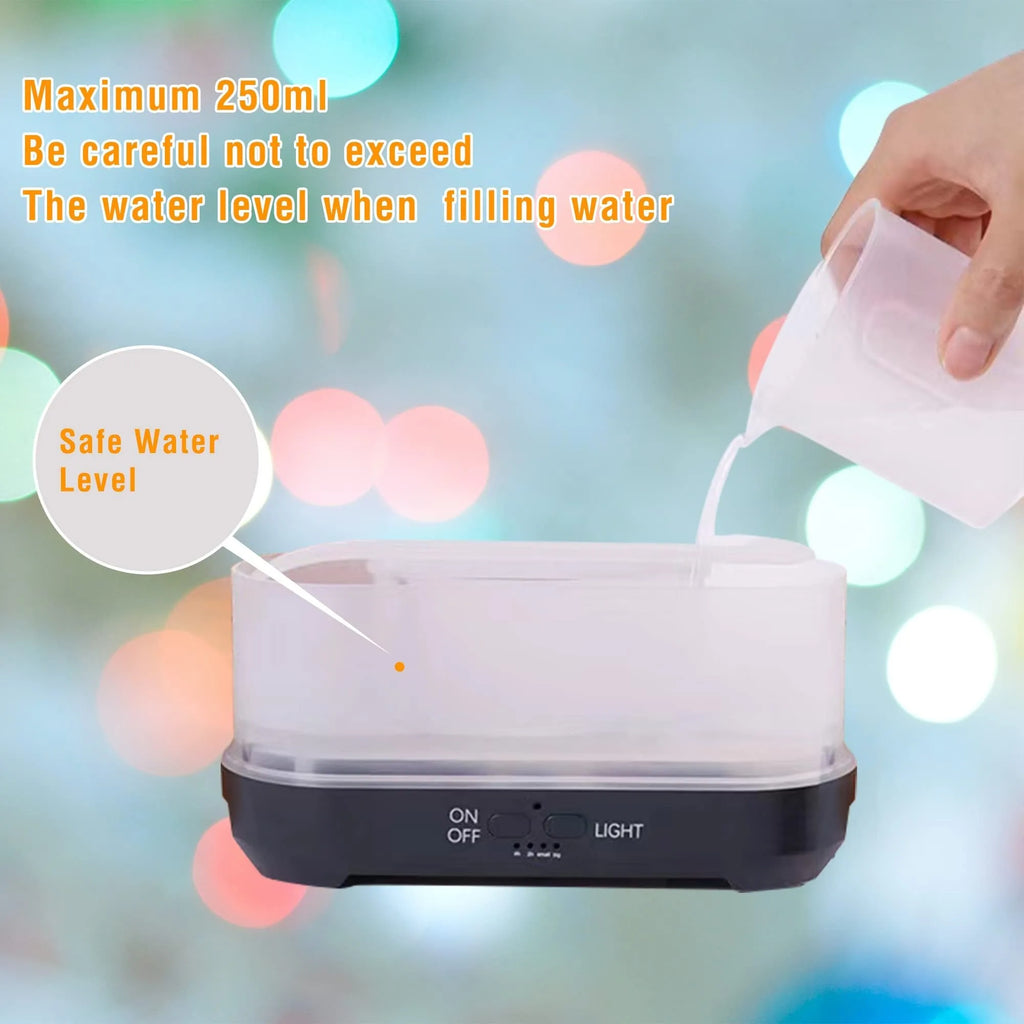 Colourful snowflake wood grain aromatherapy humidifier with glowing flame effect on a desktop.