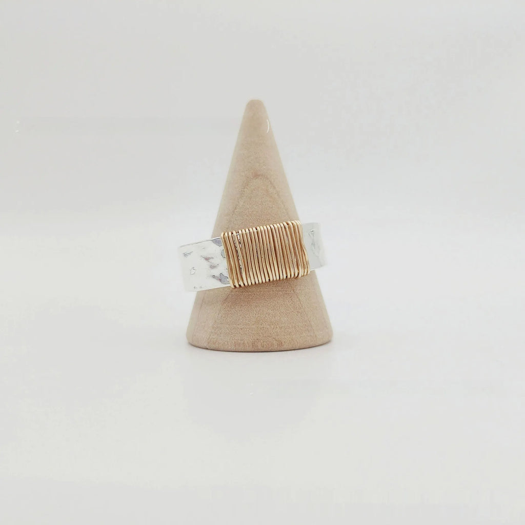Simple geometric ring bracelet in electroplated copper with silver gold coil finish showing irregular coil design