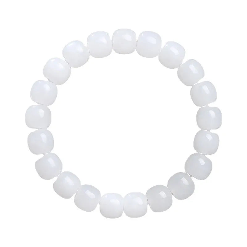 White Hetian jade barrel beads bracelet laid flat, showing unisex design and bead detail.