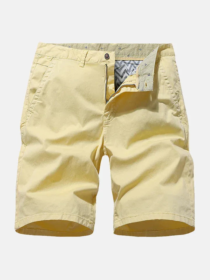 Men's blue denim casual shorts with elastic waistband on a plain background