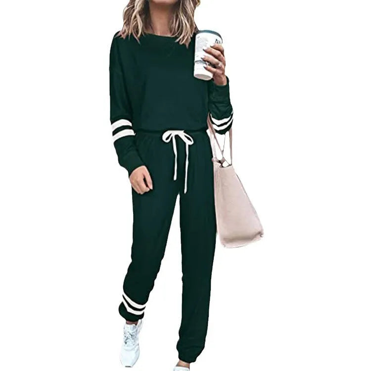 Women's plus size loose-fitting casual suit in a solid colour with long sleeves and matching trousers.