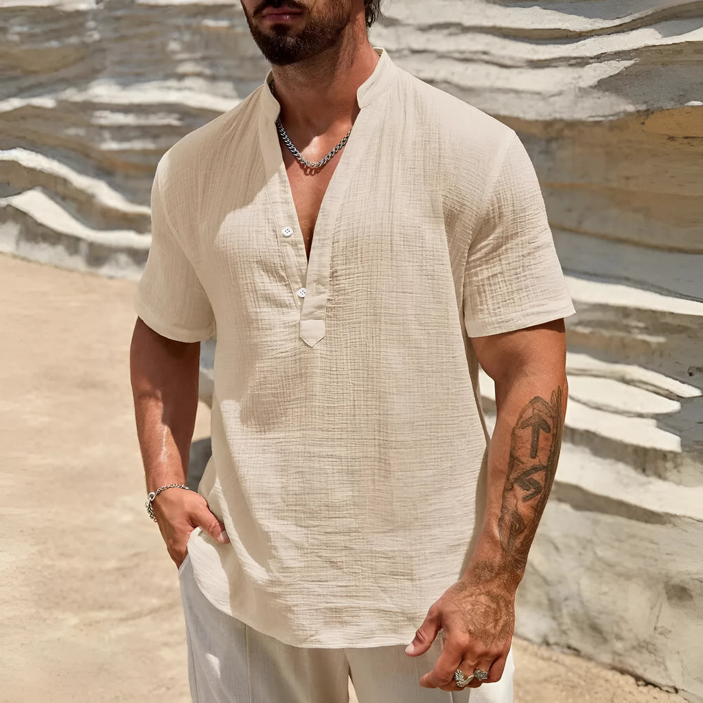Men's solid colour short-sleeve shirt with a stand collar on a hanger.