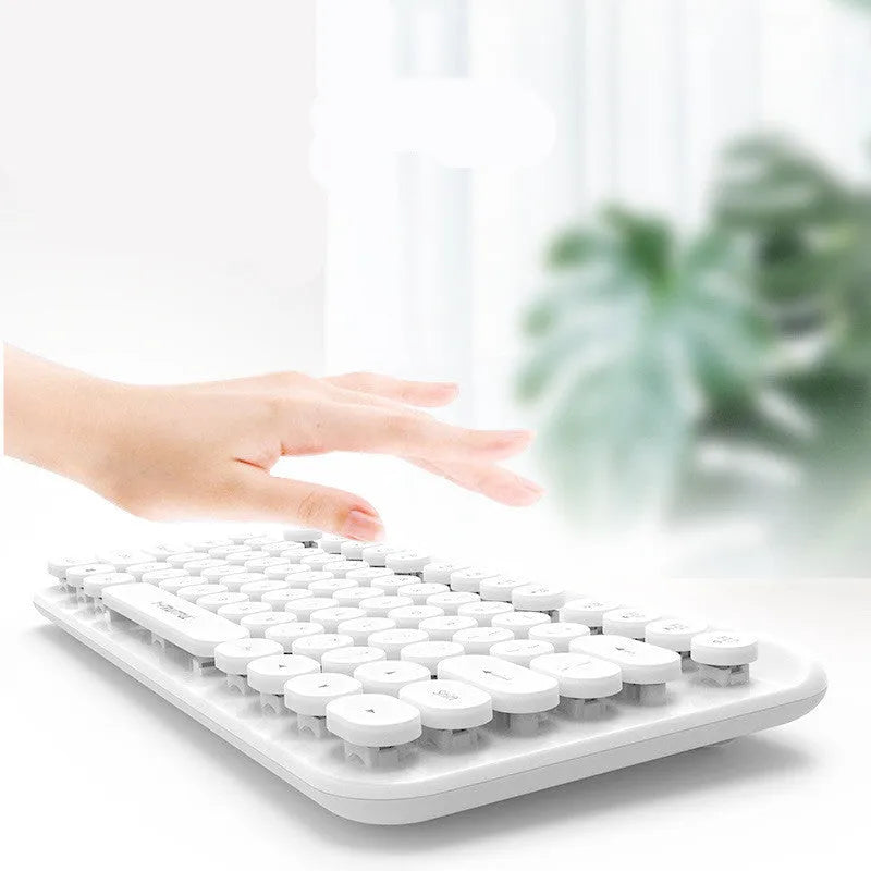 Mini 2.4G punk wireless keyboard with 75 keys, compact 30x15.5x3.5cm design, white colour, USB receiver on desk