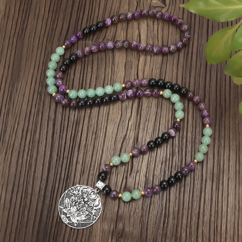 Dongling Long adjustable stone bead necklace with alloy lotus pendant and matching bracelet.