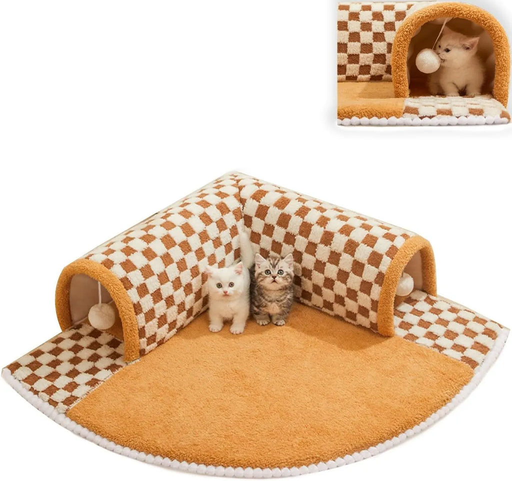 Brown plush plaid cat tunnel bed with a non-slip base on a wooden floor.