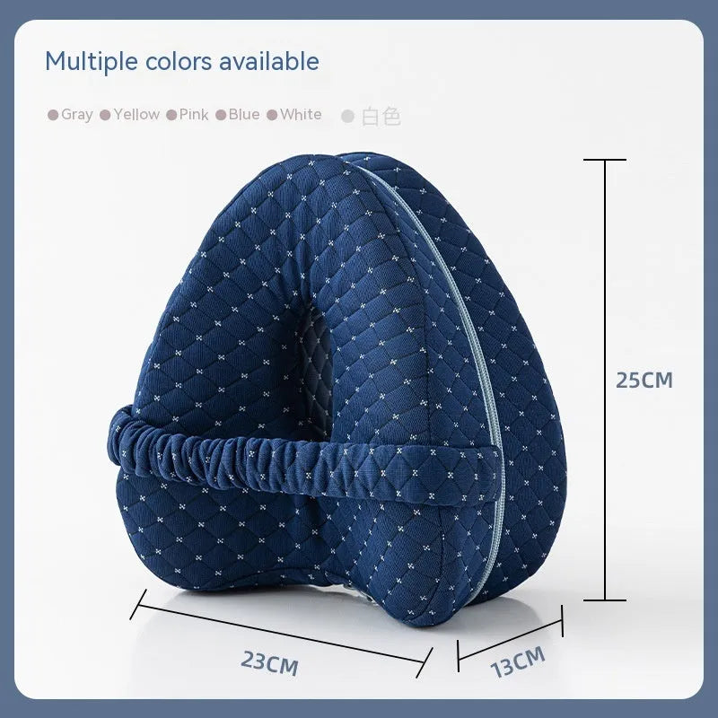 Love heart-shaped dark blue jacquard memory foam leg pillow for adults on a bed.