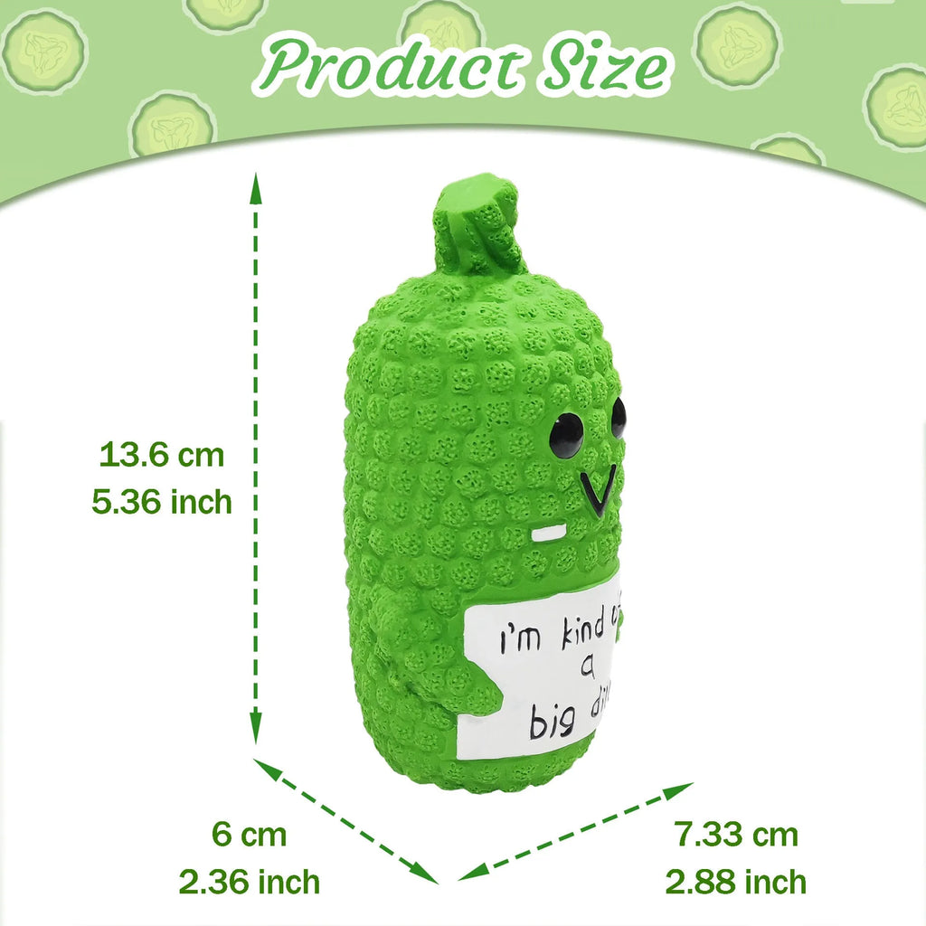 Green pickle-shaped squeaky dog toy with nubbed texture on a white background.