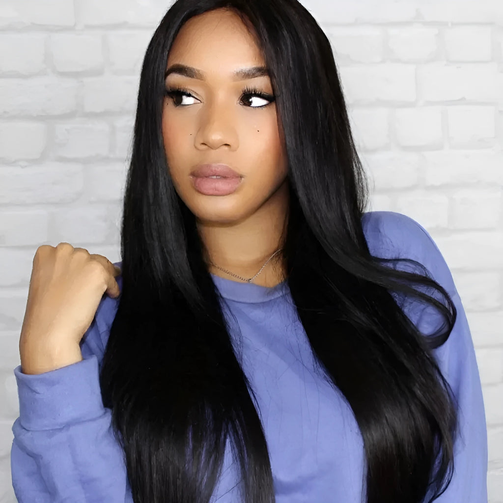 Long straight black synthetic wig with centre-parted bangs on a hair cover.