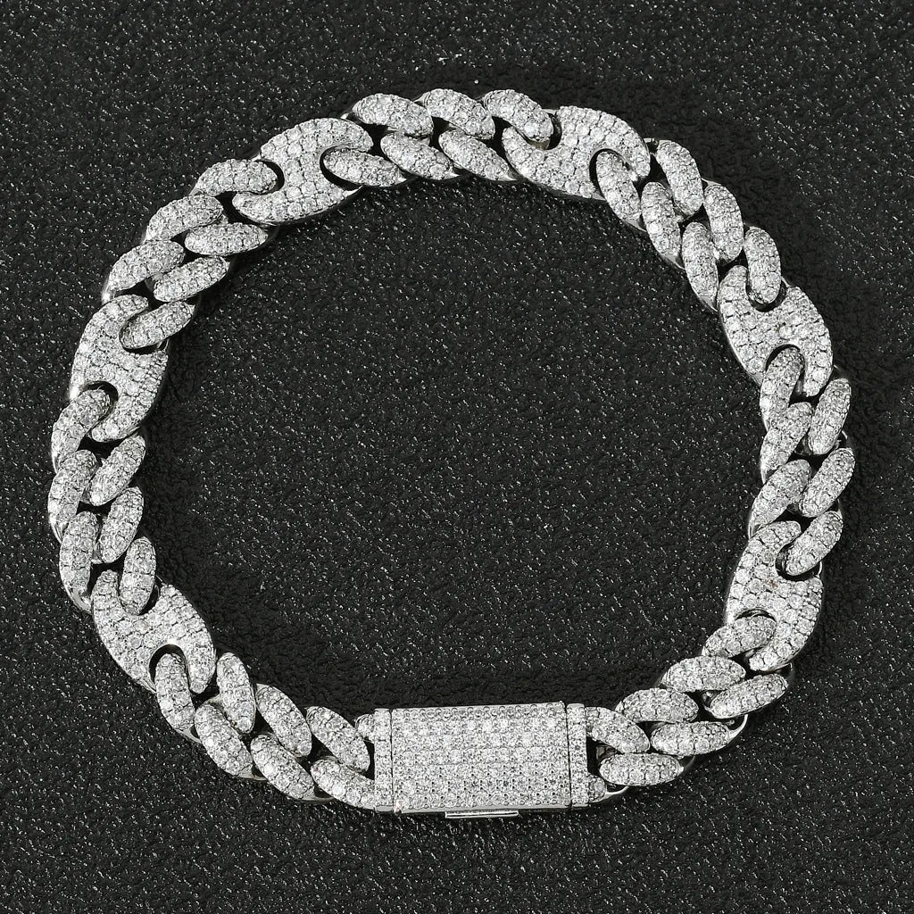 Micro inlaid zircon Cuban chain hip hop bracelet in gold and silver on a flat surface