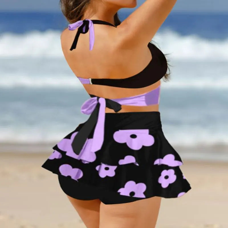 Women's purple bikini with matching skirt showing lace-up back design and high-waisted briefs