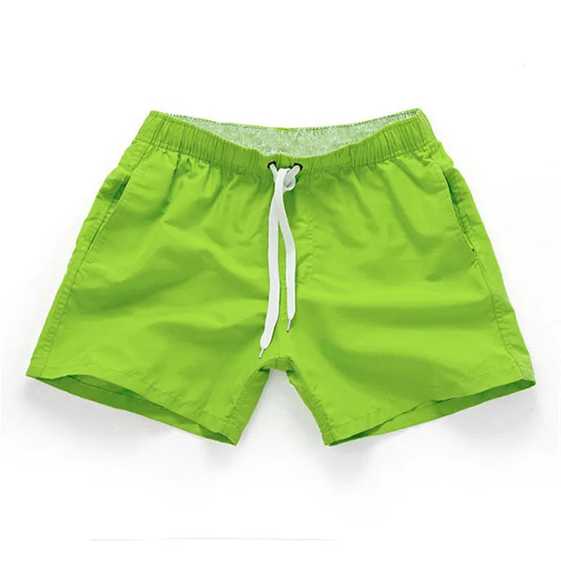 Men's black polyester beach shorts with a straight leg, shown on a size chart with options up to 4XL.