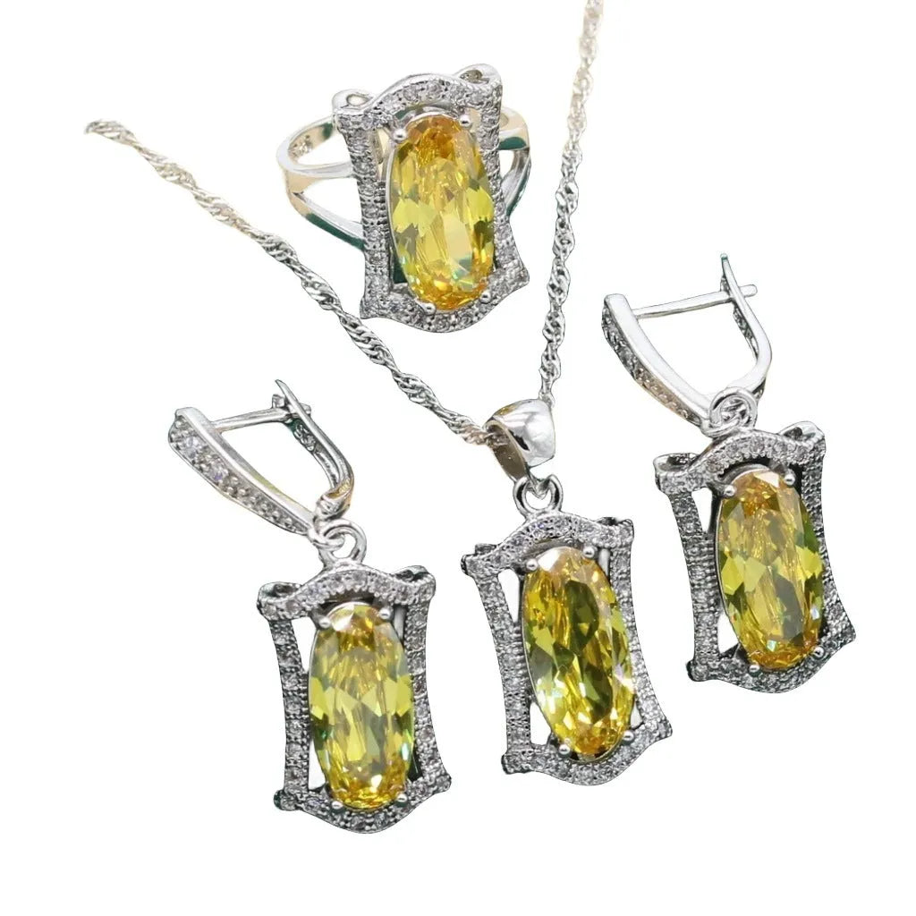 Yellow and olive alloy zircon jewellery set for women showing necklace, earrings, ring, and bracelet on display.
