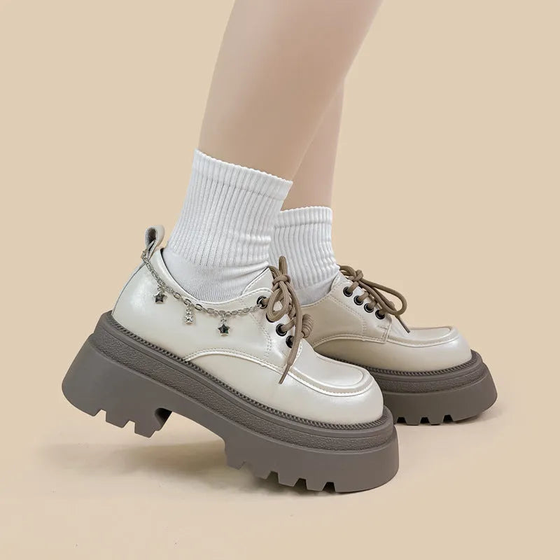 White PU platform Mary Jane shoes with thick chunky heel and front lace-up detail.