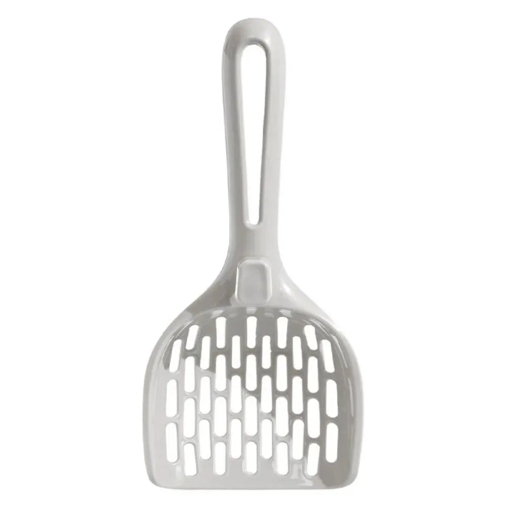 Grey plastic cat litter scoop sitting in its matching storage base