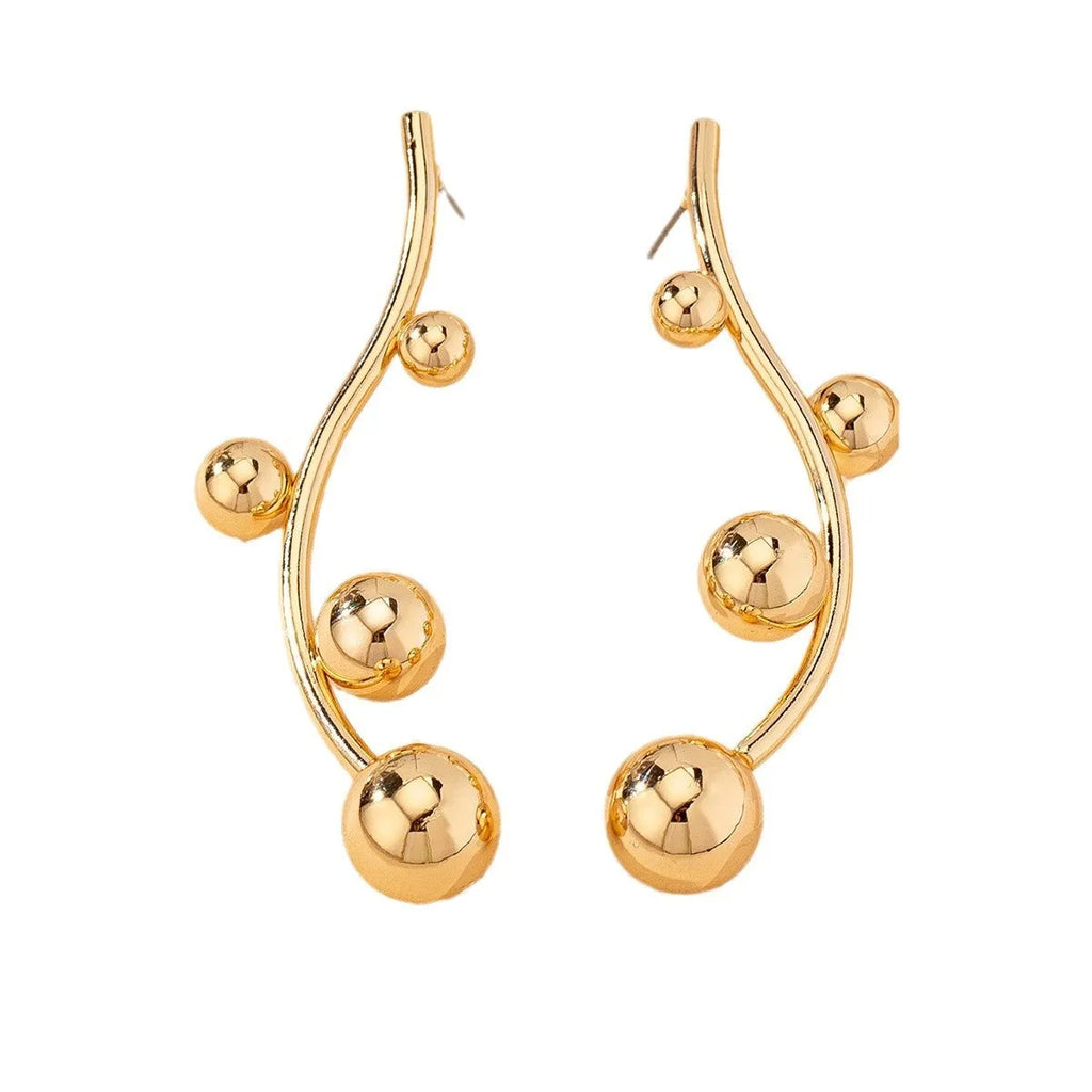Golden yellow iron ball stud earrings with round shape on a white background