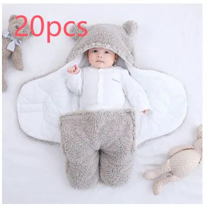 Baby quilted sleeping bag wrapper in a light blue colour showing its quilted pattern and size.