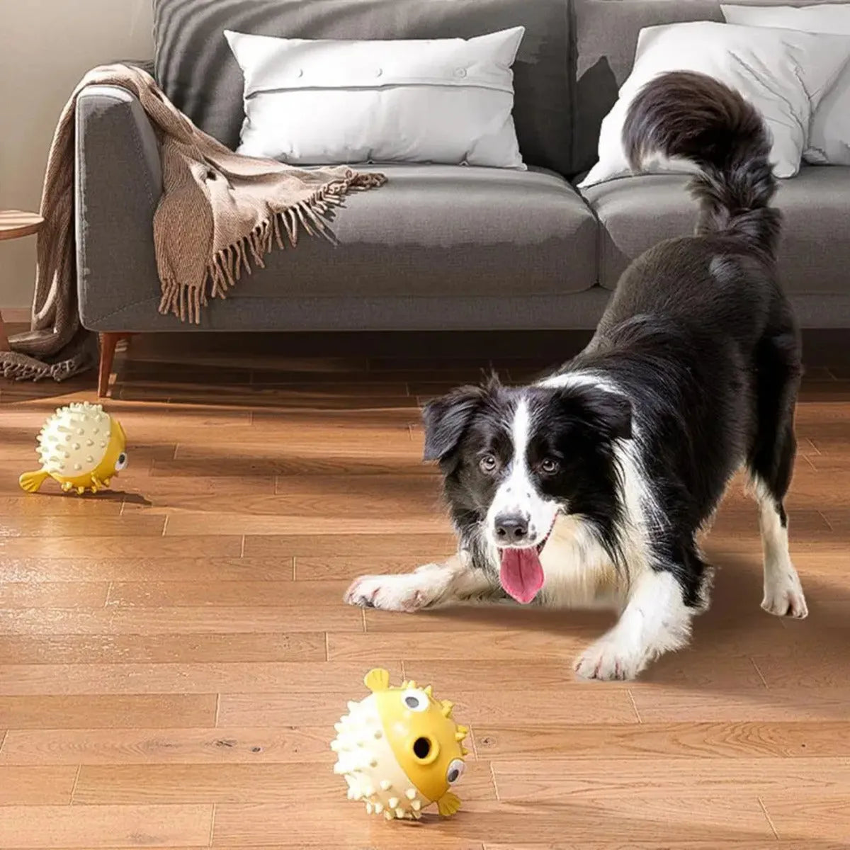 Yellow fish-shaped dog chew toy with textured surface and squeaker function