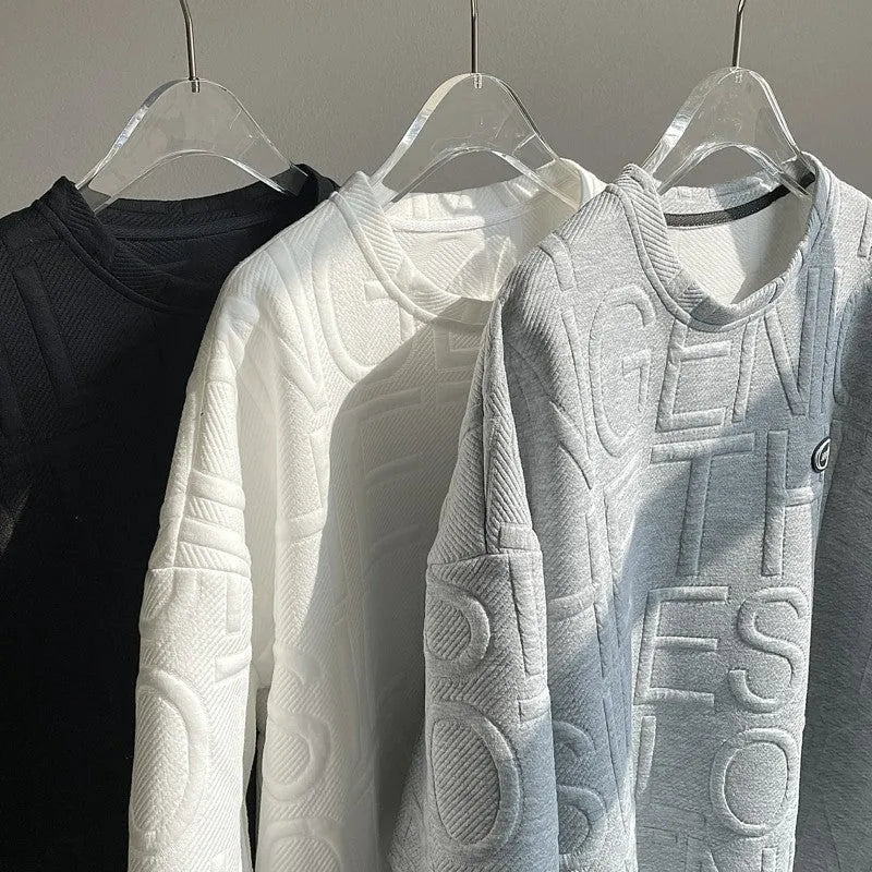 Men's grey short sleeve T-shirt with a raised 3D white letter print in a loose, retro style.