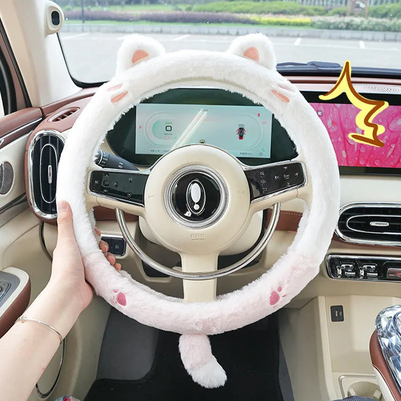Plush rabbit fur steering wheel cover with embroidered cartoon design, shown fitted on a 38cm wheel.