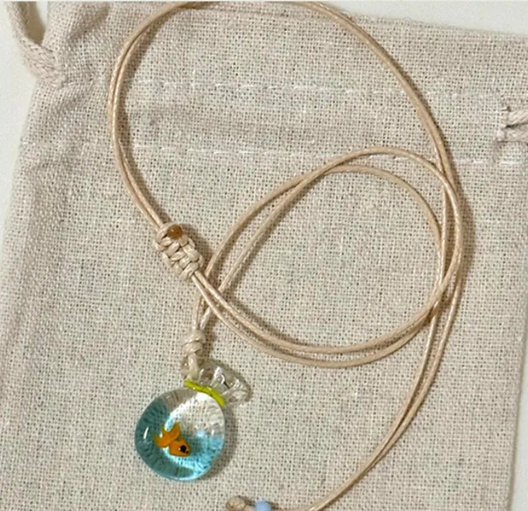 Women's skirt and joker pendant necklace with coloured glaze on cotton linen chain
