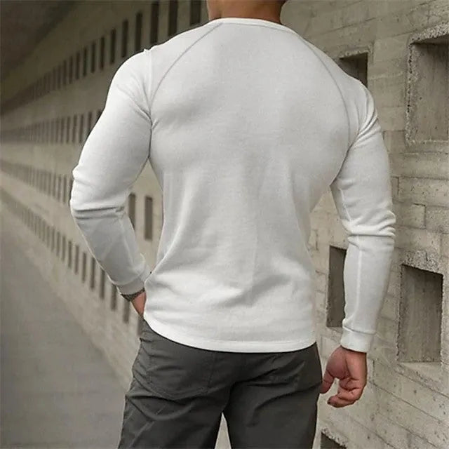 Men's white long-sleeved shirt with a Henry collar, showing collage stitching detail on the front.