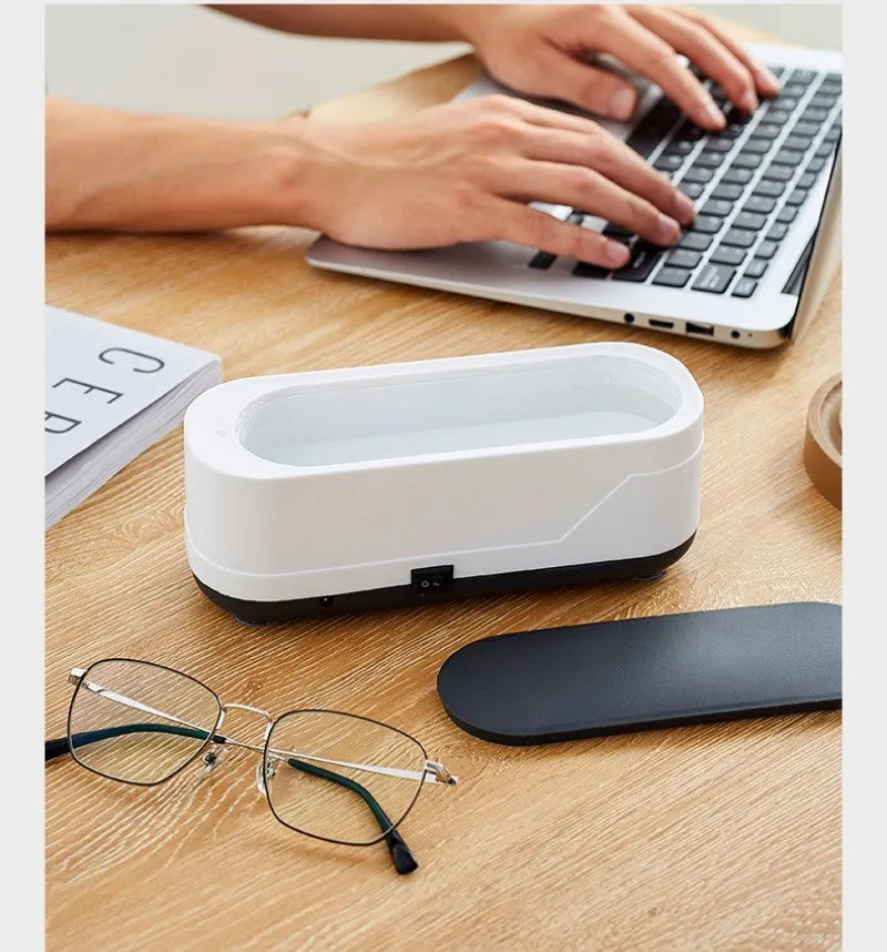 Black and white multifunctional ultrasonic cleaner for eyeglasses and jewellery with high frequency vibration
