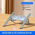 Silver aluminium alloy laptop cooling stand with dual fans in a raised, open position on a desk.