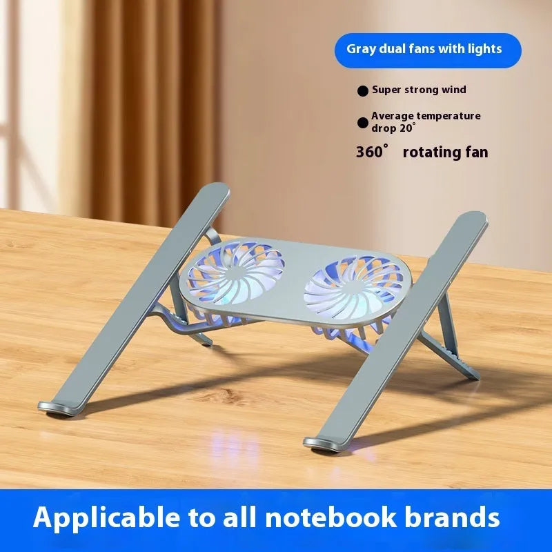 Silver aluminium alloy laptop cooling stand with dual fans in a raised, open position on a desk.