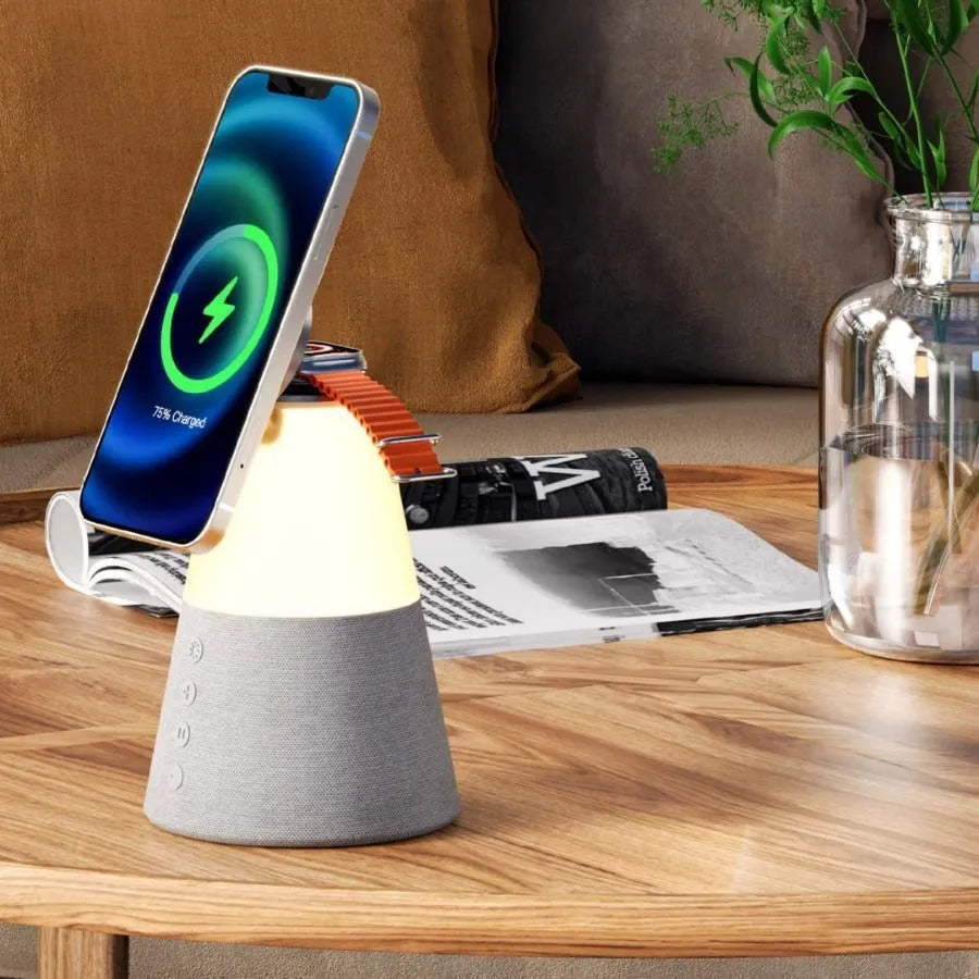 Grey 3-in-1 magnetic wireless charging Bluetooth speaker night light on a tabletop