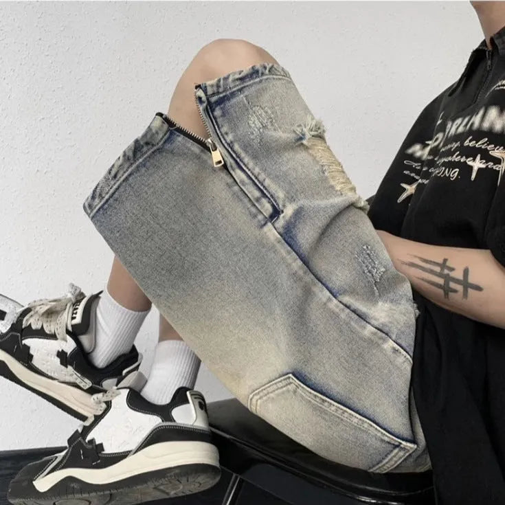 Blue retro tattered denim shorts with a wide leg loose fit on a mannequin.