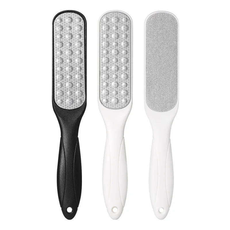 Double-sided stainless steel foot grinder with black and white abrasive pads for foot care