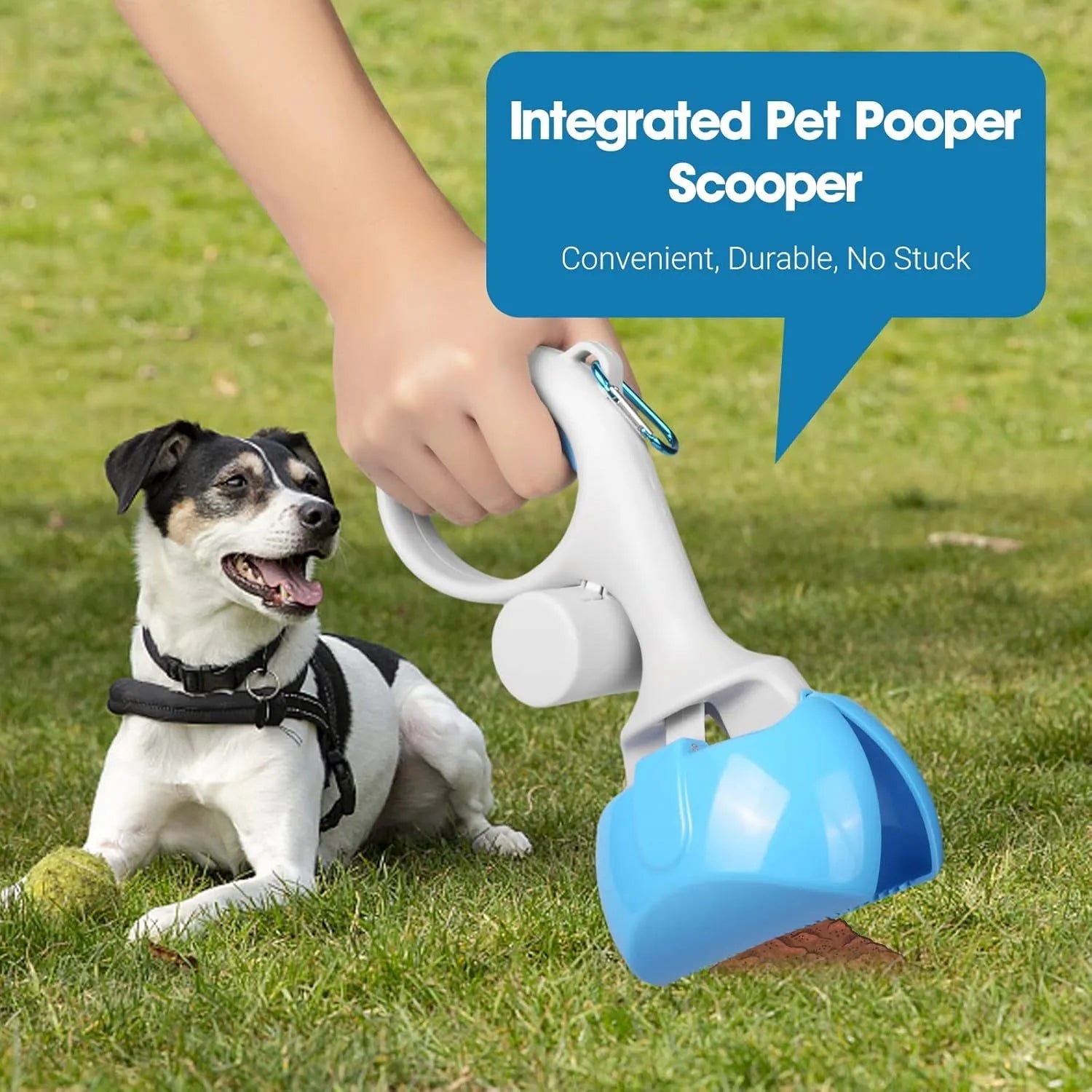 Black pet pooper scooper with built-in trash bag holder and carrying hook on a gravel path.