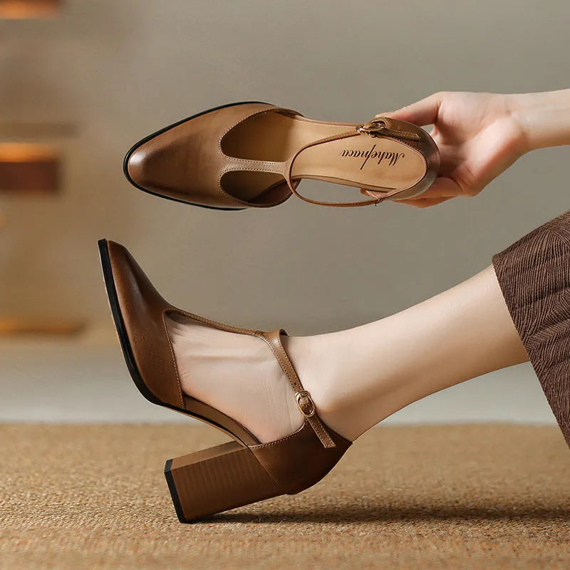Women's dark brown retro pointed Mary Jane shoes with a hollow toe design and a buckle fastening.