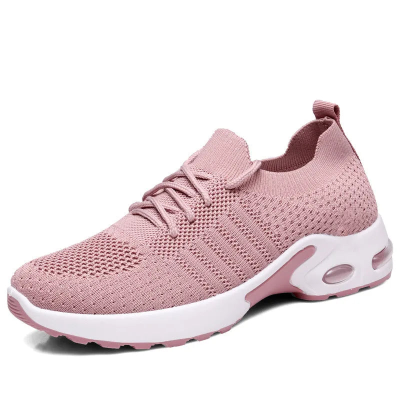 Women's solid colour mesh sneaker with round toe and lace-up front, on a non-slip PVC sole.