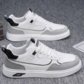 Men's low-top canvas board shoes in solid colour with leather stitching detail on a neutral background.