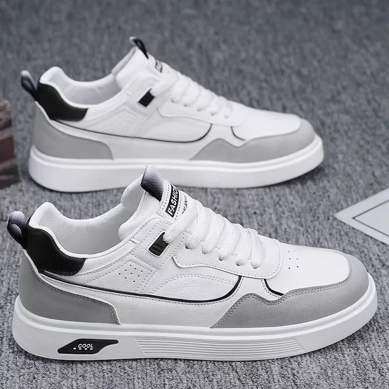 Men's low-top canvas board shoes in solid colour with leather stitching detail on a neutral background.