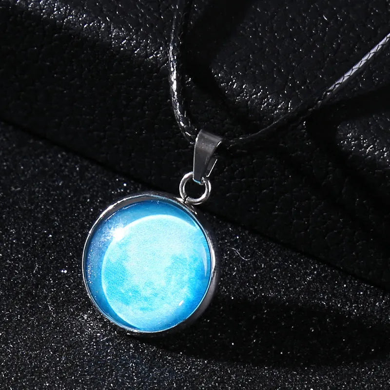 Luminous moon and constellation night sky pendant on an extendable alloy necklace chain.
