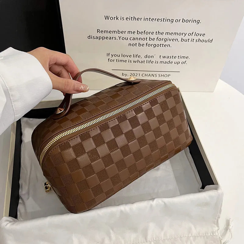 Women's PU leather cosmetic bag in solid colour, 25cm wide, shown in brown