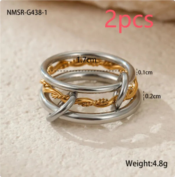 Three stacked stainless steel rings with 18K gold plating in matching design